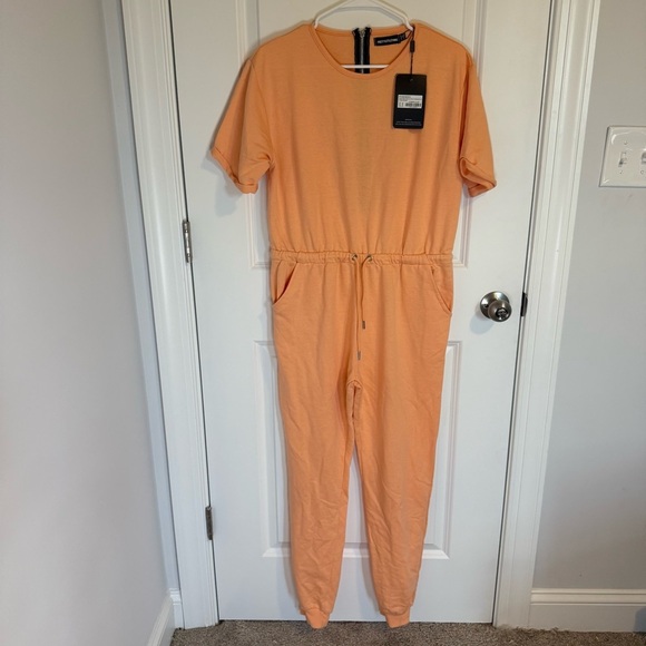 Pretty Little Things Peach Short Sleeve Jump Suit Timber Size 8 - Picture 1 of 3